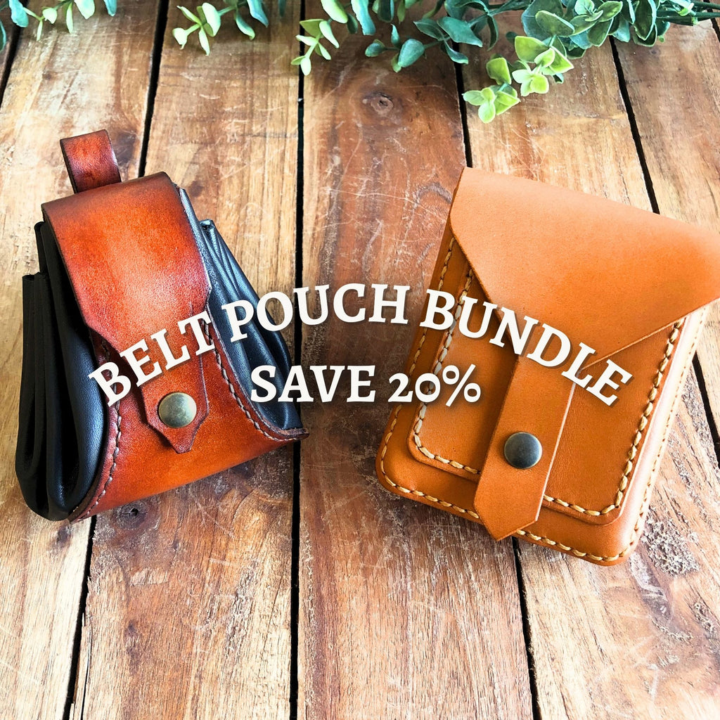 Leather drawstring dice pouch and compact belt pouch on a wooden background
