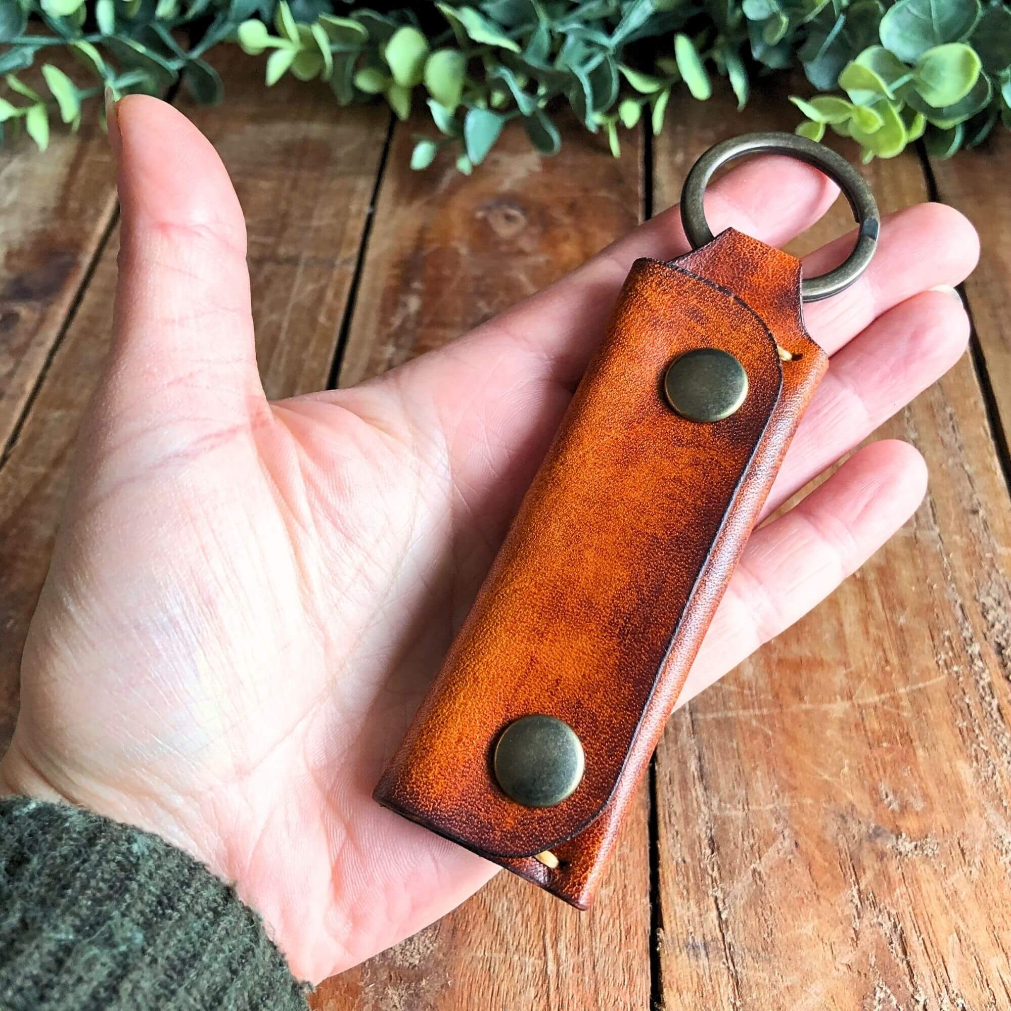 Leather Emergency Keychain Wallet  held in hand
