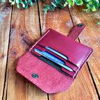 leather card wallet filled with cards 