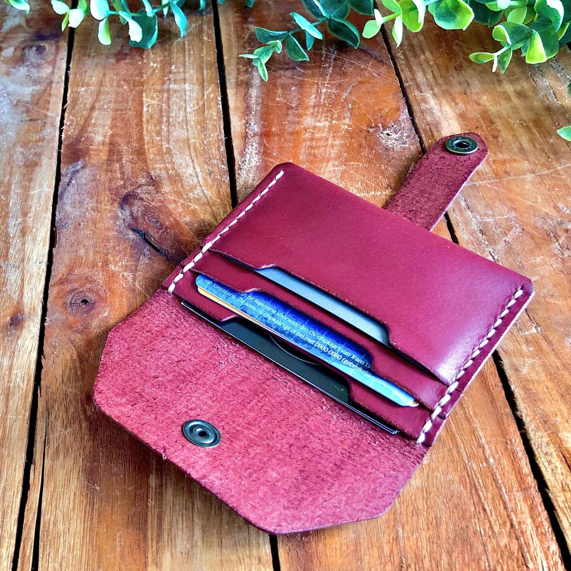 leather card wallet filled with cards 