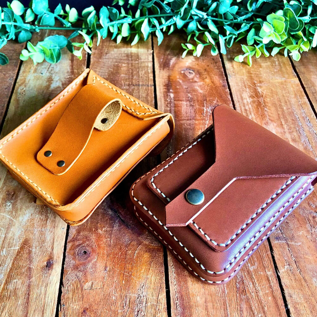 front and back view of a small leather belt bag