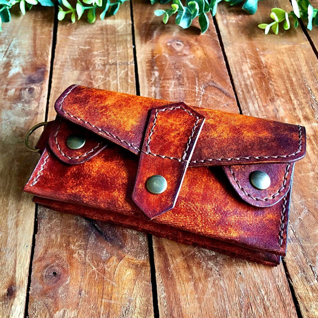 Handmade biker style leather wallet with double snap closure, aged mahogany and tan dye effect