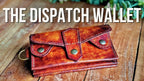 Brown leather wallet on a wooden surface with 'THE DISPATCH Wallet' text above.
