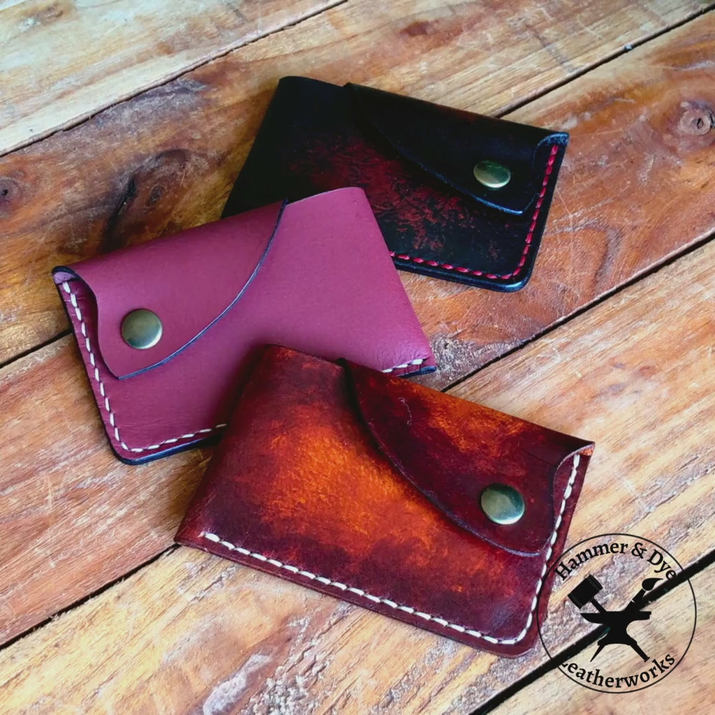 video showing compact leather card holder being opened and cards taken out